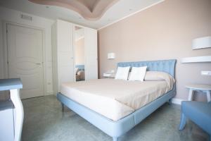 Postel nebo postele na pokoji v ubytování Cavalieri D'Oro Luxury House