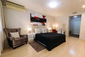 מיטה או מיטות בחדר ב-City Apartments - Junior suite room