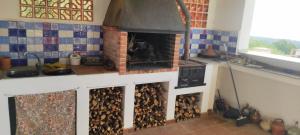 a kitchen with a brick oven in a kitchen at Flaire Mar in Tarragona