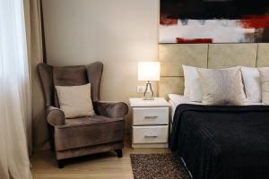 City Apartments - Junior suite room tesisinde bir odada yatak veya yataklar