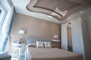 Postel nebo postele na pokoji v ubytování Cavalieri D'Oro Luxury House
