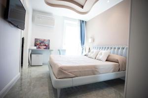 Postel nebo postele na pokoji v ubytování Cavalieri D'Oro Luxury House
