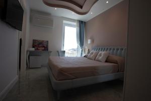 Postel nebo postele na pokoji v ubytování Cavalieri D'Oro Luxury House