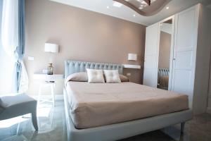 Postel nebo postele na pokoji v ubytování Cavalieri D'Oro Luxury House
