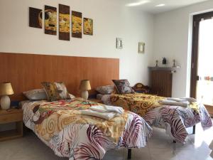 Katil atau katil-katil dalam bilik di Villa Romeo - Acero Rosso