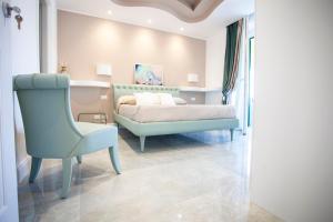 Postel nebo postele na pokoji v ubytování Cavalieri D'Oro Luxury House
