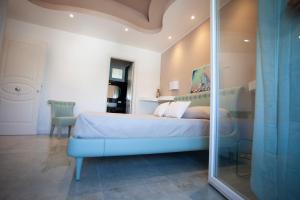 Postel nebo postele na pokoji v ubytování Cavalieri D'Oro Luxury House