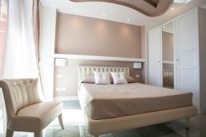 Postel nebo postele na pokoji v ubytování Cavalieri D'Oro Luxury House
