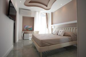 Postel nebo postele na pokoji v ubytování Cavalieri D'Oro Luxury House