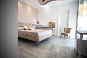 Postel nebo postele na pokoji v ubytování Cavalieri D'Oro Luxury House
