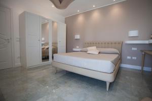 Postel nebo postele na pokoji v ubytování Cavalieri D'Oro Luxury House