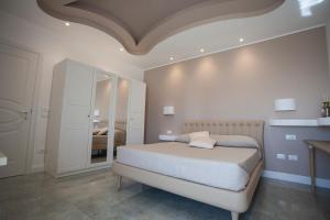 Postel nebo postele na pokoji v ubytování Cavalieri D'Oro Luxury House