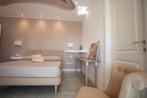 Postel nebo postele na pokoji v ubytování Cavalieri D'Oro Luxury House