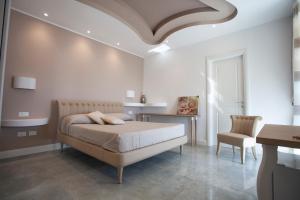 Postel nebo postele na pokoji v ubytování Cavalieri D'Oro Luxury House