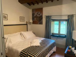 Postel nebo postele na pokoji v ubytování Albergo Le Casaline
