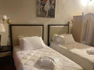 Postel nebo postele na pokoji v ubytování Albergo Le Casaline