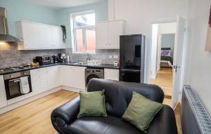 a living room with a couch in a kitchen at CityMan Manchester in Manchester