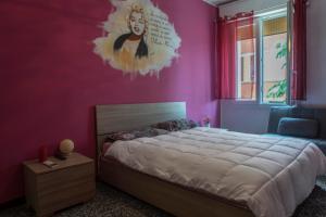 Кровать или кровати в номере FLY HOUSE BOLOGNA...un appartamento al volo