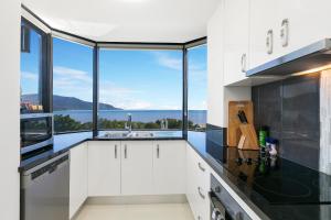 A kitchen or kitchenette at Cairns Luxury Waterfront Apartment