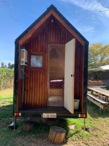 a tiny house on a trailer with a door open at Tiny House Remanso del Espíritu in Isla de Maipo