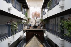 
a large building with many windows and lots of stairs at Hostel Cuore Kurashiki in Kurashiki
