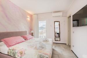 Postel nebo postele na pokoji v ubytování Casa Catò