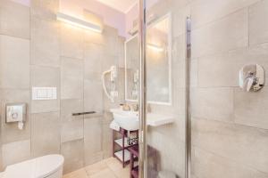 a bathroom with a sink and a toilet and a shower at Casa Catò in Vernazza