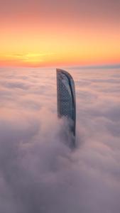 a building in the sky above the clouds at Niccolo Suzhou in Suzhou