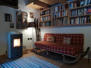 a living room with a couch and a fire place at Bed & Breakfast Campaciol in Livigno