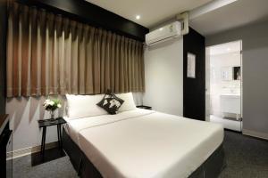 Postel nebo postele na pokoji v ubytování Taichung Box Design Hotels