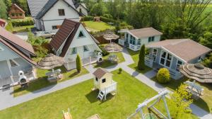 a model of a house and a home with a yard at Puszczykowo in Stegna