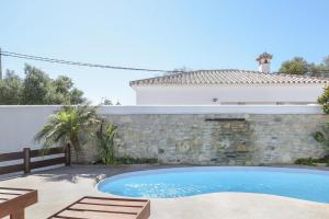 a swimming pool in the backyard of a house at Casa - 4 Mar y Arena in Barbate
