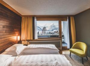Postel nebo postele na pokoji v ubytování BOUTIQUEHOTEL das edelweiss