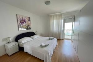 Ένα ή περισσότερα κρεβάτια σε δωμάτιο στο Holiday House Sea View