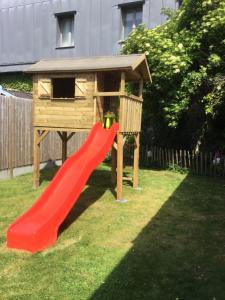 a playground with a slide and a bird house at oyenkerke in De Panne
