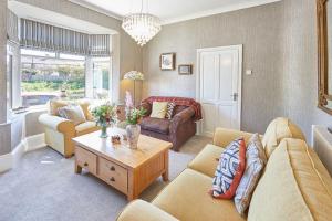a living room with couches and a coffee table at Host & Stay - The Beach House in Marske-by-the-Sea