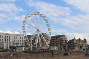 a ferris wheel in the middle of a city at Parasol Weston Guest House in Weston-super-Mare
