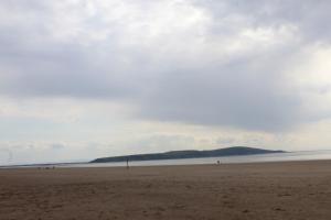 a view of a beach with people on it at Parasol Weston Guest House in Weston-super-Mare