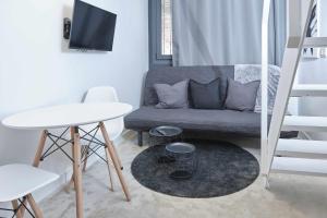 Televízia a/alebo spoločenská miestnosť v ubytovaní ANDALUCIA Modern & Luxury