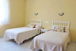 Posteľ alebo postele v izbe v ubytovaní Pensión Residencia Casa Teresa + 14 fotografií
