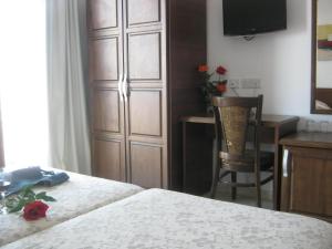 Postel nebo postele na pokoji v ubytování Palates Hotel