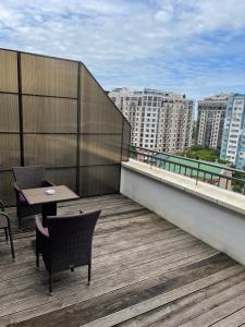 a balcony with a table and chairs on a building at Апартаменты Ясная Поляна in Odesa