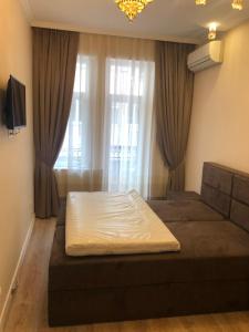 A television and/or entertainment centre at CENTER APARTMENT PLOVDIV