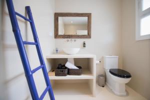 a ladder in a bathroom with a sink and a toilet at Quinta la Sal in Jávea