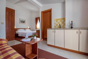 Postel nebo postele na pokoji v ubytování Hotel Posejdon