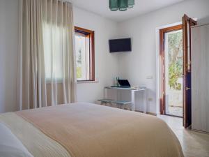Una cama o camas en una habitación de Rifugio di Puglia - Trulli & Dimore