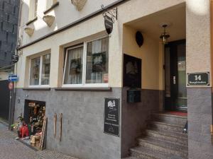 a store front of a building on a street at Pension Winnemuller in Cochem