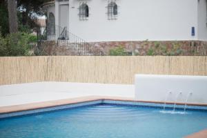 a swimming pool with water fountains in a yard at Quinta la Sal in Jávea