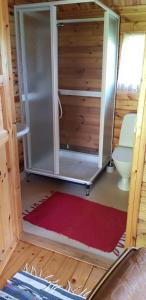 an open door of a toilet in a tiny house at Lill Hagahus, Söderåsens Nationalpark in Kågeröd