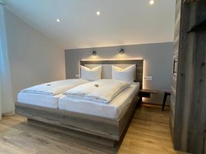 Voodi või voodid majutusasutuse Hotel Kosel garni UG toas